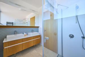 a bathroom with two sinks and a shower at Apartmány Pampeliška in Černý Dŭl +41 photos