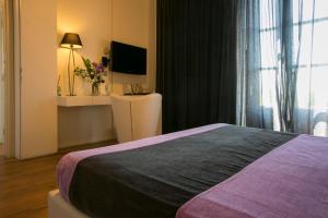 A bed or beds in a room at Spa Resort Fonte Alla Lepre