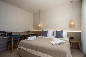 Кровать или кровати в номере Este Elegant Suites & Villas