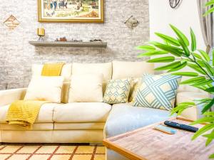 a living room with a couch and a table at Major by Unik Vacation in Tarragona