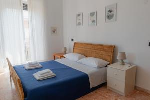 Postel nebo postele na pokoji v ubytování Casa vacanze Omero 2