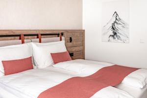 Voodi või voodid majutusasutuse Tailormade Hotel KRONE Sarnen toas