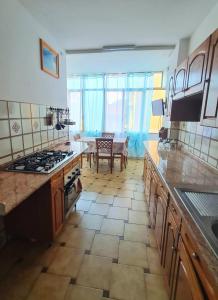 a kitchen with a stove and a counter top at Gente di Mare Apartment Tropea Center in Tropea