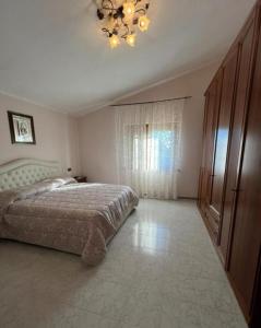 Ένα ή περισσότερα κρεβάτια σε δωμάτιο στο Villa l oleandro