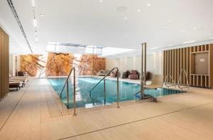 a large swimming pool in a hotel room at Boutique apartment with spectacular view of the Eilat mountains in Eilat