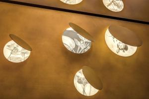 a group of clocks hanging on a wall at Dimora Coppelle - Adults Only in Rome