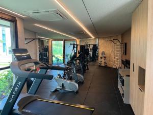 a gym with treadmills and machines in a room at FLAT BEACH CLASS SUMMEr PORTO DE GALINHAS in Porto De Galinhas