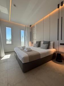 a bedroom with a large bed in a room at Tuck Inn in Larnaca
