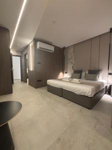 a bedroom with a large bed in a room at Tuck Inn in Larnaca