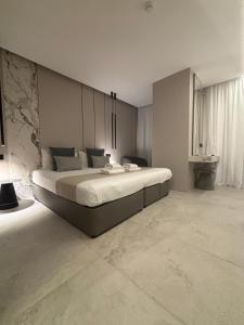 a large bedroom with a large bed in it at Tuck Inn in Larnaca