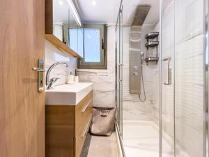 a bathroom with a sink and a shower at Panorama View with Private Hot Tub by 8essentially in Daratso +22 photos