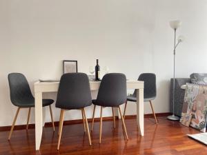 a dining room table with four chairs around it at One bedroom apartment Podgorica in Podgorica