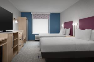 Home2 Suites By Hilton Columbus Easton客房内的一张或多张床位