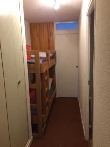 a small room with a bunk bed and a hallway at Studio cabine 5 couchages - Station du Collet d'Allevard in Allevard