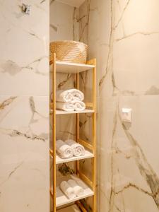 a towel rack in a bathroom with towels at Terra Residence in Ágios Rókkos +23 photos