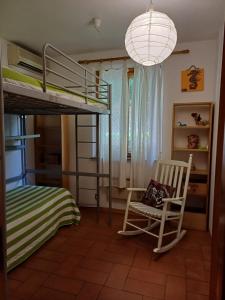Postel nebo postele na pokoji v ubytování CASA VACANZE IN CAPRAIA ISOLA