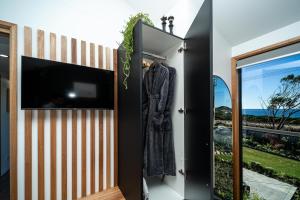 Et tv og/eller underholdning på Ocean Breeze Homestays 2