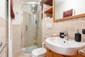 a bathroom with a sink and a shower at Chalet Après-ski Courmayeur center in Courmayeur +10 photos