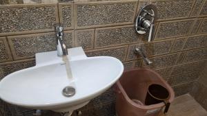 a bathroom with a sink and a toilet at The Rabbit Hotel in Bareilly +9 photos