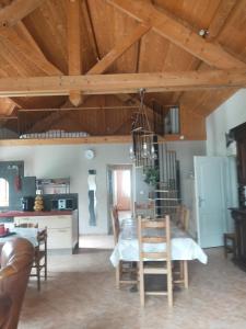 a dining room and kitchen with a table and chairs at Maison de Martine & Christian in Eaux-Bonnes