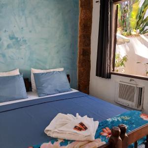 Postel nebo postele na pokoji v ubytování Villa dos Pássaros Paraty Hospedagem