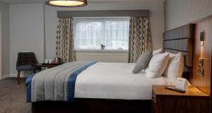 a hotel room with a large bed and a window at Lancashire Manor Hotel, BW Signature Collection in Skelmersdale +89 photos