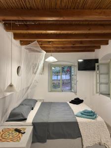 Katil atau katil-katil dalam bilik di Petrino 1 - Traditional Lerian House +19 gambar