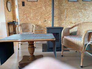 a table and two chairs in a room at Equi Guidance Studio in Wapenveld +39 photos