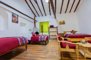 Postel nebo postele na pokoji v ubytování Tucan Hostel