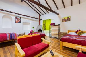 Postel nebo postele na pokoji v ubytování Tucan Hostel