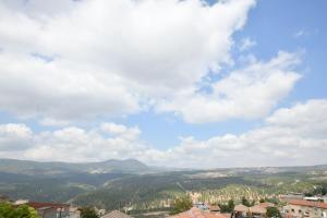 a view of a valley with mountains in the distance at אחוזת ישוב הדעת in Safed