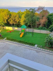 an aerial view of a park with a playground at Kuya Os Staycation at Royal Oceancrest Condominium Panglao in Dauis