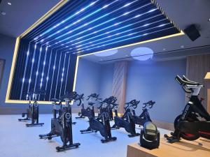 a gym with a bunch of exercise bikes in a room at Hipotels Barrosa Garden in Chiclana de la Frontera