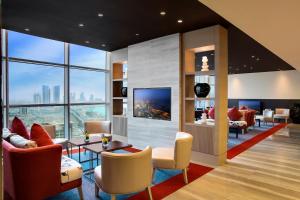a hotel lobby with a view of the city at Downtown Rotana in Manama