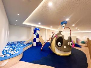 a childs room with a bed and a lady bug at Hipotels Barrosa Garden in Chiclana de la Frontera