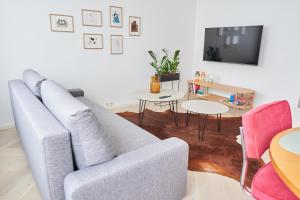 a living room with a couch and a tv at Aia kodu in Haapsalu