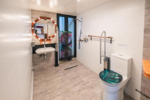 a bathroom with a toilet and a sink at AYCA La Flora Hotel Boutique in Valparaíso +73 photos