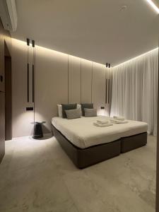 a bedroom with a large bed in a room at Tuck Inn in Larnaca