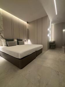 a bedroom with a large bed in a room at Tuck Inn in Larnaca
