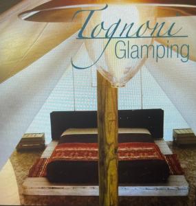 Postel nebo postele na pokoji v ubytování Glamping Agricampeggio Tognoni + 35 fotografií