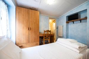 Postel nebo postele na pokoji v ubytování Albergo Monte Giove + 5 fotografií