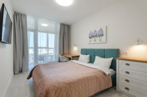 Ένα ή περισσότερα κρεβάτια σε δωμάτιο στο Petrovdom Apartments 17-86а in RC Kvartet , Vasyl Lypkivskyi 16а