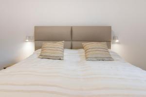 Postel nebo postele na pokoji v ubytování New Luxury Stay in Old Town with free Garage + 14 fotografií