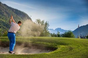 a man standing in the sand on a golf course at Studio in Bad Aussee - Steiermark 428 in Bad Aussee