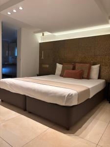 a bedroom with a large bed in a room at Tuck Inn in Larnaca