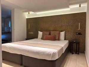 a bedroom with a large bed in a room at Tuck Inn in Larnaca