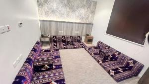 an overhead view of a room with chairs and a screen at Al-Kkulfaa Al-Faisaliah - فندق الخلفاء الفيصليه in Makkah +14 photos