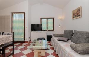 a living room with a couch and a table at Villa Ivka-Omis by Villas Guide in Katuni