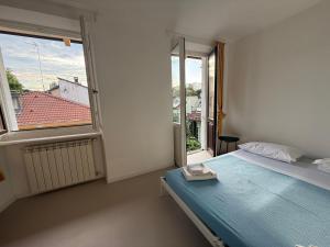 Ένα ή περισσότερα κρεβάτια σε δωμάτιο στο Grazioso alloggio a 10 minuti dal centro