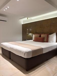 a bedroom with a large bed in a room at Tuck Inn in Larnaca